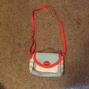 Aldo bright blue stripe red lips crossbody purse